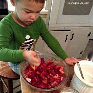 Helping mama to make a simple strawberry crisp for church.