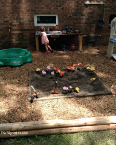 An awesome outdoor mud kitchen made with repurposed items from around the yard and house. Our new favorite backyard hangout!