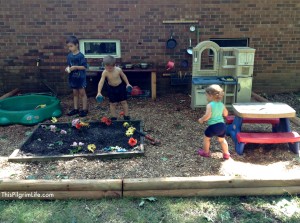 An awesome outdoor mud kitchen made with repurposed items from around the yard and house. Our new favorite backyard hangout!