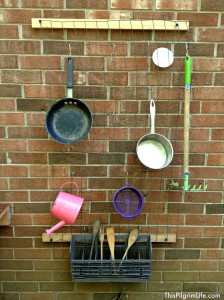 An awesome outdoor mud kitchen made with repurposed items from around the yard and house. Our new favorite backyard hangout!
