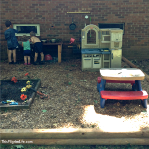 An awesome outdoor mud kitchen made with repurposed items from around the yard and house. Our new favorite backyard hangout!