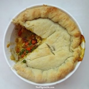 Homemade chicken pot pie, packed full of juicy chicken, bacon, eggs, and vegetables.