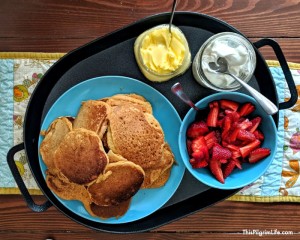 This is one pancake recipe you want to have in your back pocket! It's super easy and so versatile. Serve them with butter and maple syrup, fresh fruit and whipped cream, throw in some blueberries...the options are endless! This is one pancake recipe you want to have in your back pocket! It's super easy and so versatile. Serve them with butter and maple syrup, fresh fruit and whipped cream, throw in some blueberries...the options are endless! After going strawberry picking earlier this week, my middle son had one request-- pancakes with strawberries and fresh whipped cream for breakfast. I was personally looking forward to strawberries with vanilla ice cream and my grandmother's pound cake, but pancakes sounded good too. Thankfully, my son was eager with both ideas and help. We mixed the batter together, and then he took over cooking the pancakes on our new cast iron griddle. This is one pancake recipe you want to have in your back pocket! It's super easy and so versatile. Serve them with butter and maple syrup, fresh fruit and whipped cream, throw in some blueberries...the options are endless! Back Pocket Pancakes Print Back Pocket Pancakes Back Pocket Pancakes3 This is one pancake recipe you want to have in your back pocket! It’s super easy and so versatile. Serve them with butter and maple syrup, fresh fruit and whipped cream, throw in some blueberries…the options are endless! Author: Lisa @ This Pilgrim Life Prep Time: 10 minutes Total Time: 10 minutes Yield: About 30 4" pancakes Category: Breakfast Ingredients 3 C flour 1 Tbsp baking powder 1 tsp baking soda 1/4 C maple syrup 2 eggs 1/4 C melted butter 2 – 2 1/2 C milk or whey Instructions Heat a cast iron griddle or other griddle over medium heat. (If not using cast iron, you can wait until about five minutes before starting before heating the pan). Melt the butter and set aside to cool slightly. Mix together the dry ingredients in a medium mixing bowl. In a large measuring cup, whisk the maple syrup and eggs. Stir in the cooled melted butter, and then 2 cups of the milk/whey. Add additional milk/whey a tablespoon at a time until you reach the desired consistency. (When I use fresh flour, I add an additional half cup because the fresh flour absorbs more liquid). Grease your griddle with a thin layer of butter, then pour quarter cup portions on the griddle, about an inch apart. Cook the pancakes until small bubbles appear on the surface, then flip them over and cook for one to two minutes on the other side until golden brown. Continue cooking the pancakes until you run out of batter, keeping the cooked pancakes in the warm oven until you are ready to eat. Serve with maple syrup, butter, fresh fruit, whipped cream, or other toppings of choice. Notes I use this pancake recipe for almost all our pancake breakfasts. It’s very versatile. Change things up by adding sweet spices, blueberries, chocolate chips, etc. Sharing is caring! Don’t forget to pin and share. Thank you! This is one pancake recipe you want to have in your back pocket! It's super easy and so versatile. Serve them with butter and maple syrup, fresh fruit and whipped cream, throw in some blueberries...the options are endless!