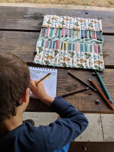 Keep pens, colored pencils, and crayons organized and easy to use with a fun pencil roll-up! Find both video and written instructions for this simple sewing project.