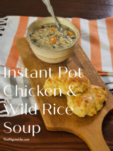 Instant Pot Chicken and Wild Rice soup is so easy to make-- just dump everything in the Instant Pot and cook-- and is so tasty too! The soup is perfect with its rich and creamy broth, fluffy rice, chicken, and vegetables. 