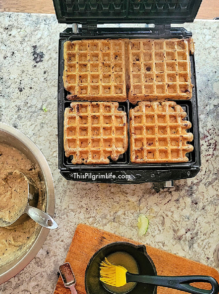 I love the taste of these chocolate chip zucchini waffles! Made with sourdough discard, shredded zucchini, and bits of chocolate, they're such a fun and tasty breakfast! 