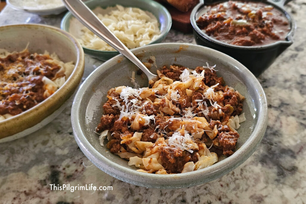 This rich, homemade ragu sauce is full of flavor, filling meat and veggies, and is incredibly delicious served over pasta. This recipe is a great way to elevate jarred or homemade marinara sauces!